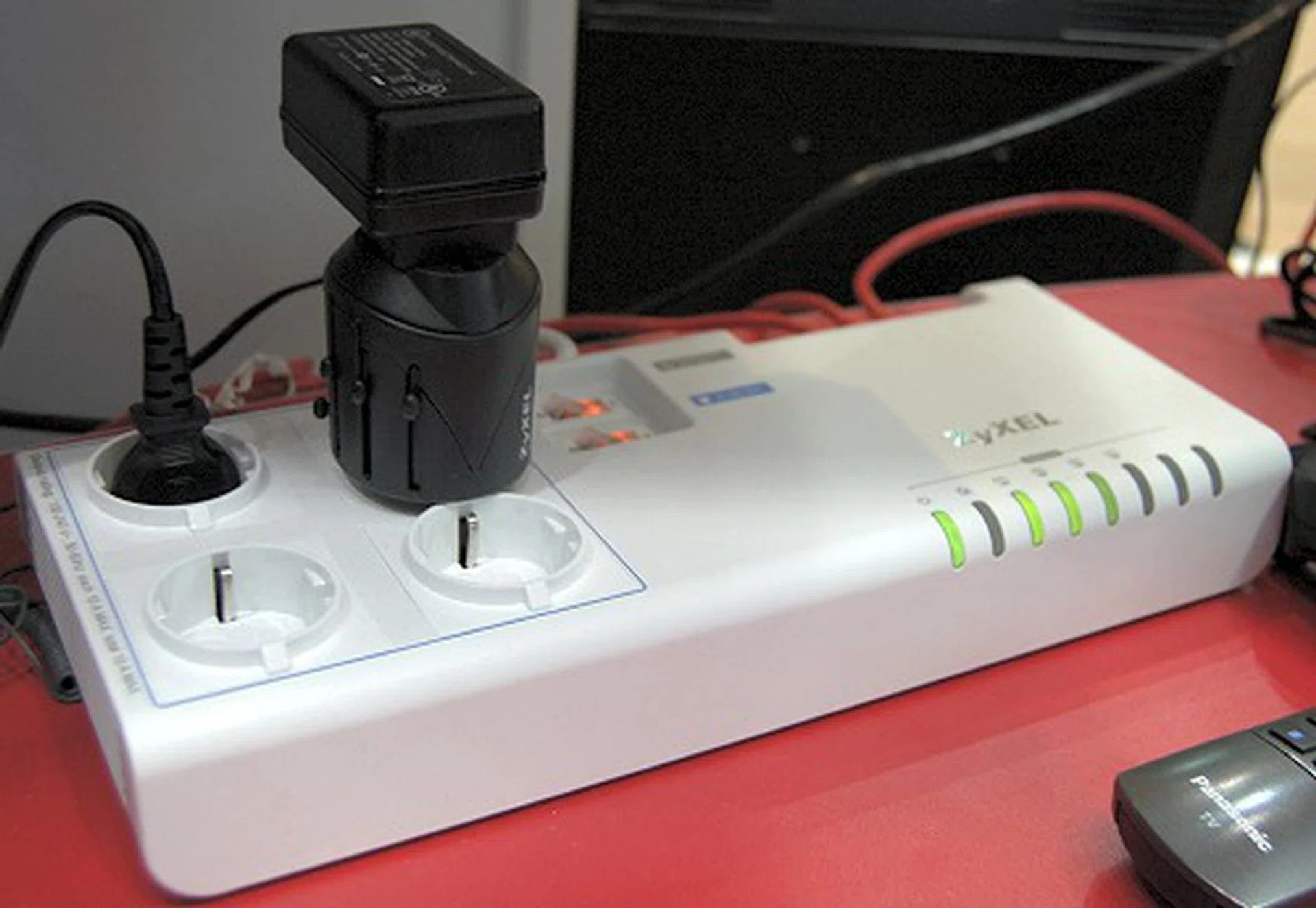  Here's a PowerLine Ethernet Multiplug Center (PLA-491). It is HomePlug AV compliant and supports transmission rates up to 200Mbps, has a four-port 10/100Mbps Ethernet for multiple powerline connections and a Home Plug instant encryption feature (toggled via a button).  