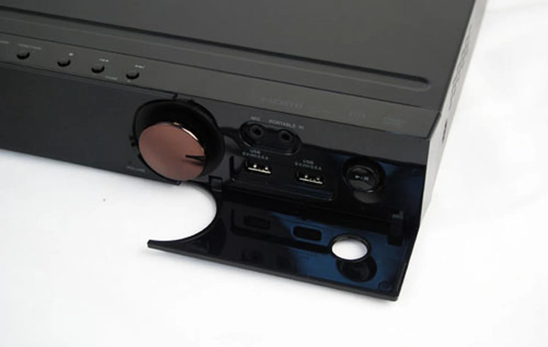 A new flap on the right hand side covers two USB ports, a microphone and auxiliary audio (3.5mm) input ports as well.