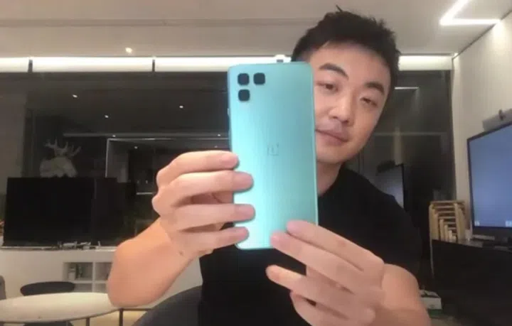 OnePlus co-founder, Carl Pei, shows off a OnePlus Nord design mock-up that didn't make the cut. OnePlus was exploring square cut-outs for rear cameras at one point. Credit: Marques Brownlee.