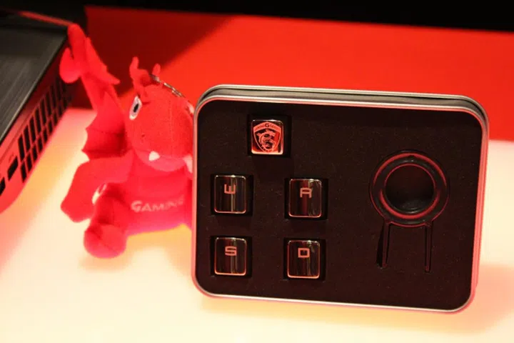 The metal W,A,S,D keys come free with the GT80. That cute dragon sadly doesn't.
