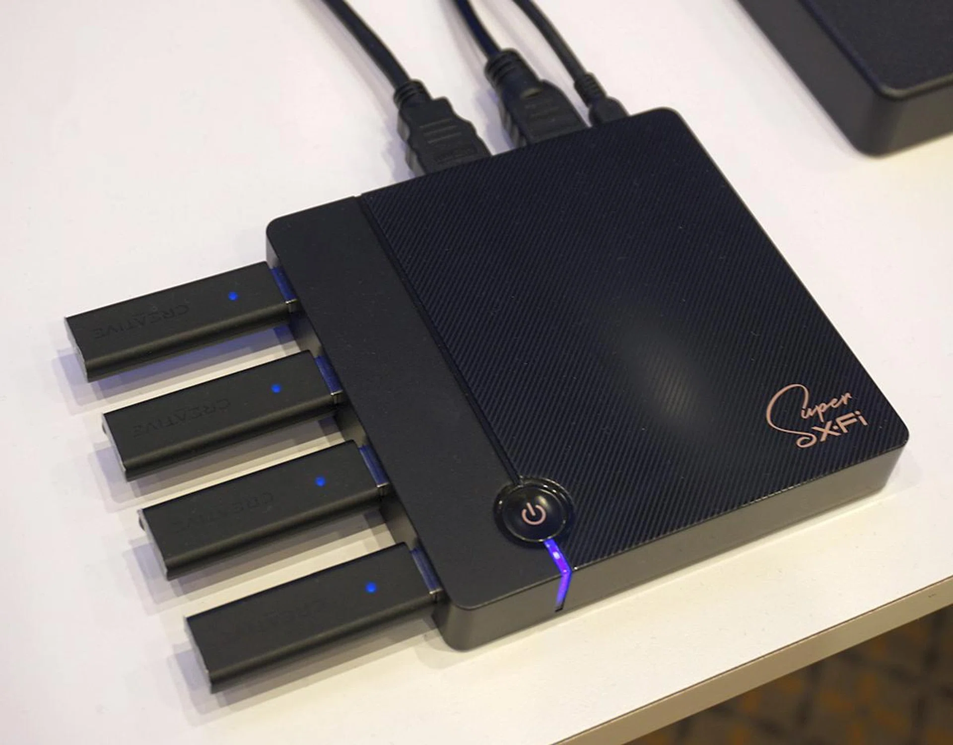 The SXFI TV box has dual HDMI ports (one in, one out), and four USB ports to take in up to four wireless USB dongles. That means you could pair it with up to four SXFI Theater headphones, with each person having their personalized mapped profile activated for best individual listening needs.