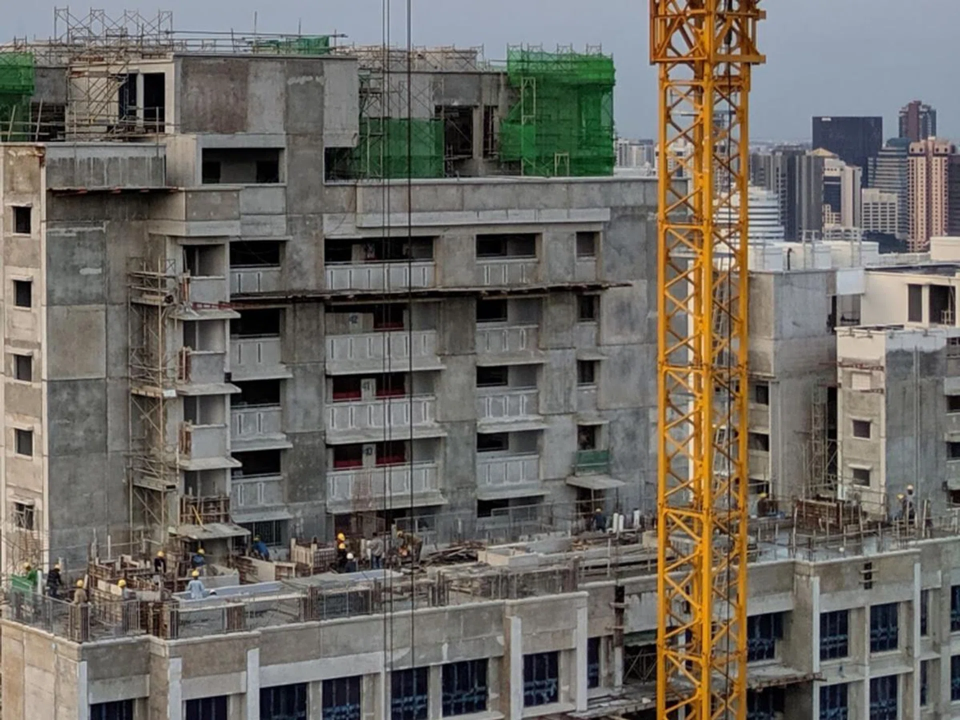 ...but the Pixel 3A XL’s rendition still packs more detail - look at the scaffolding, especially where it meets the green netting at the upper center of the frame. (Click for full-size original image)