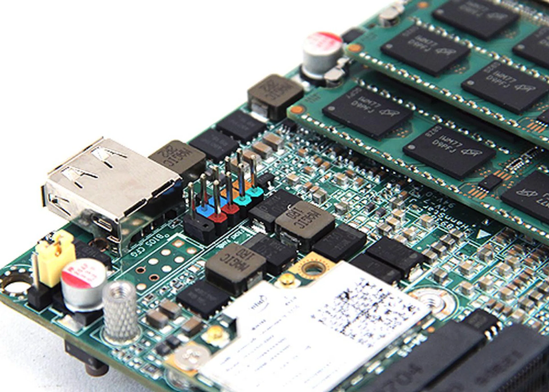 Oddly there's a front panel header and an unsoldered USB header. We figure that Intel is also selling this compact motherboard to OEM vendors who would likely put together their own mini chassis depending on the requirements of their partners. Thus the reason these headers are factored into the basic design of the board.