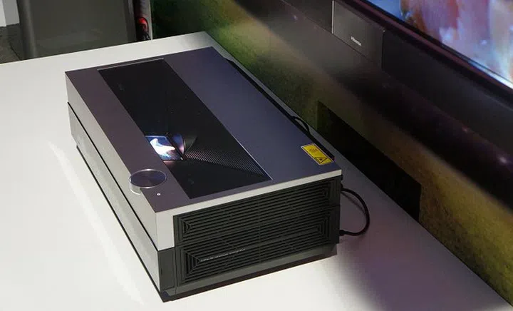 It's an ulttra short throw projector, which means it needs very little room between itself and the display area.