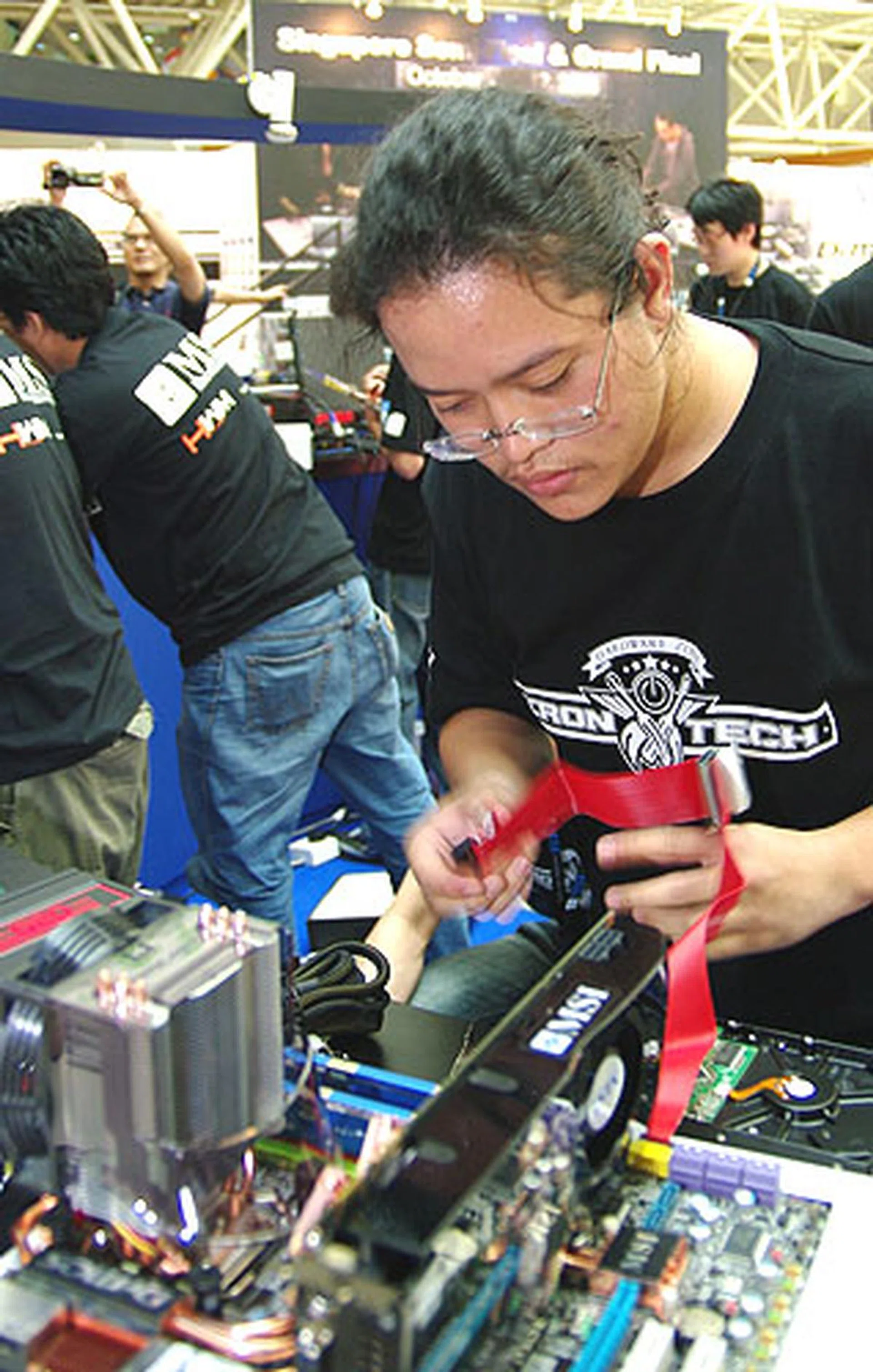  Indonesia's Alva Jonathan connecting some cables.  