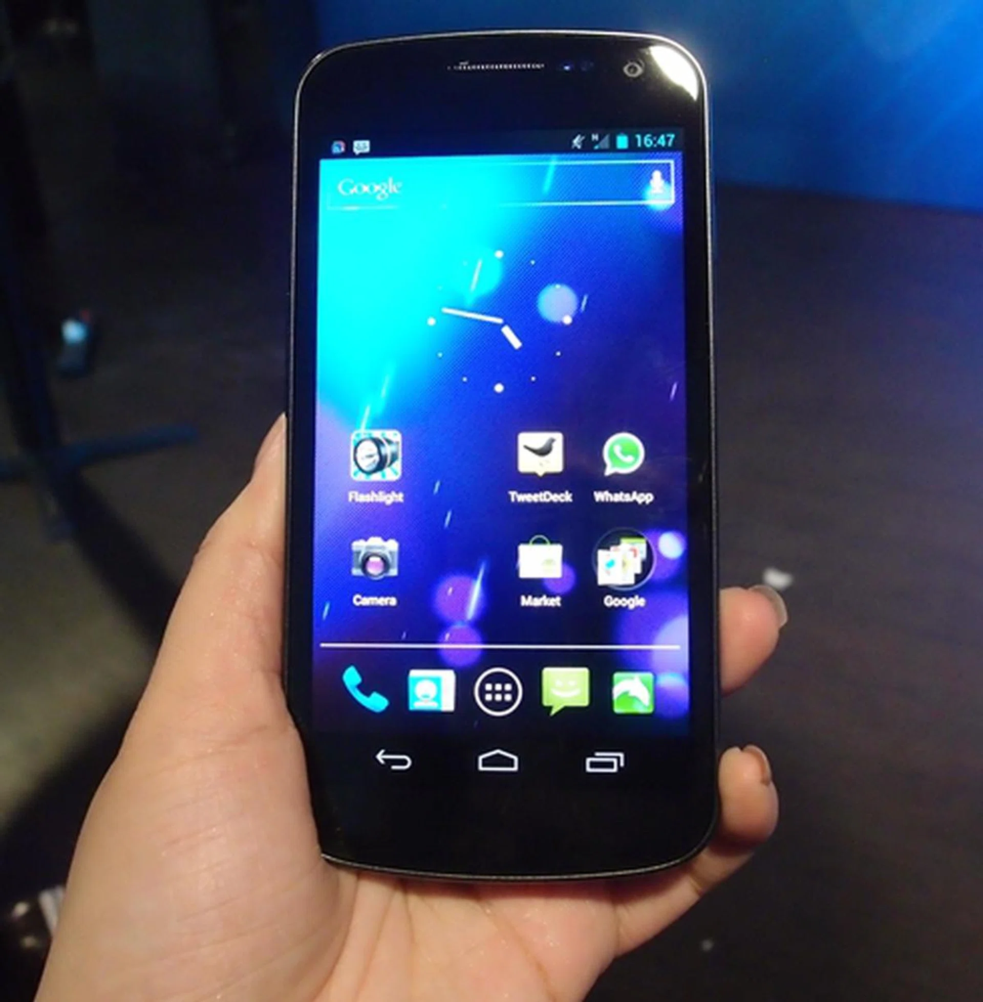 We managed to take a quick snapshot of a Samsung representative's Galaxy Nexus handset. The 4.65-inch Super HD AMOLED touch screen and on-screen navigation buttons, among other things, differentiate the handset from the others.