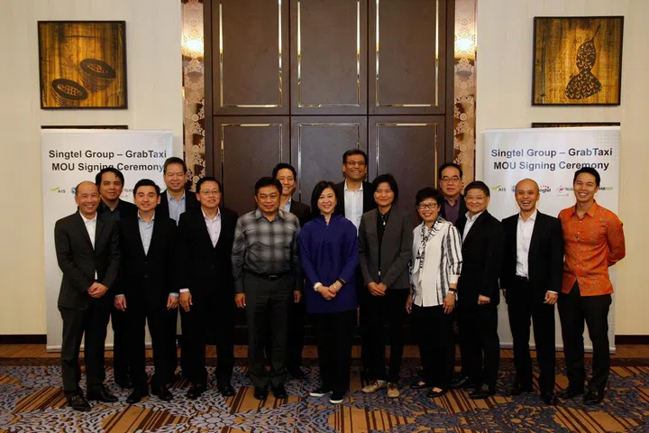 Signing Ceremony between GrabTaxi, Singtel Group, and the region's telcos who are partnering up for the mobile wallet initiative.