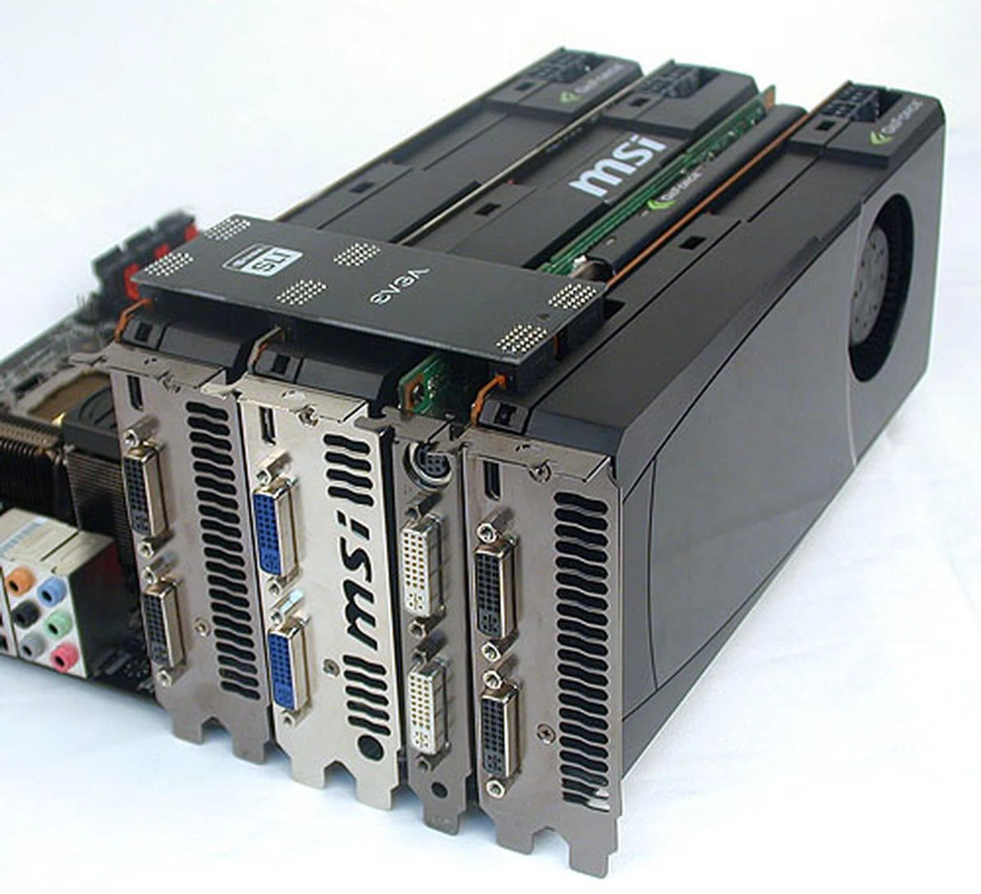 And this is how EVGA intends users to setup their graphics cards for 3-way SLI with PhysX support. The single-slot, slower graphics card for PhysX is sandwiched between the dual-slot cards and the SLI bridge is designed exactly for this.