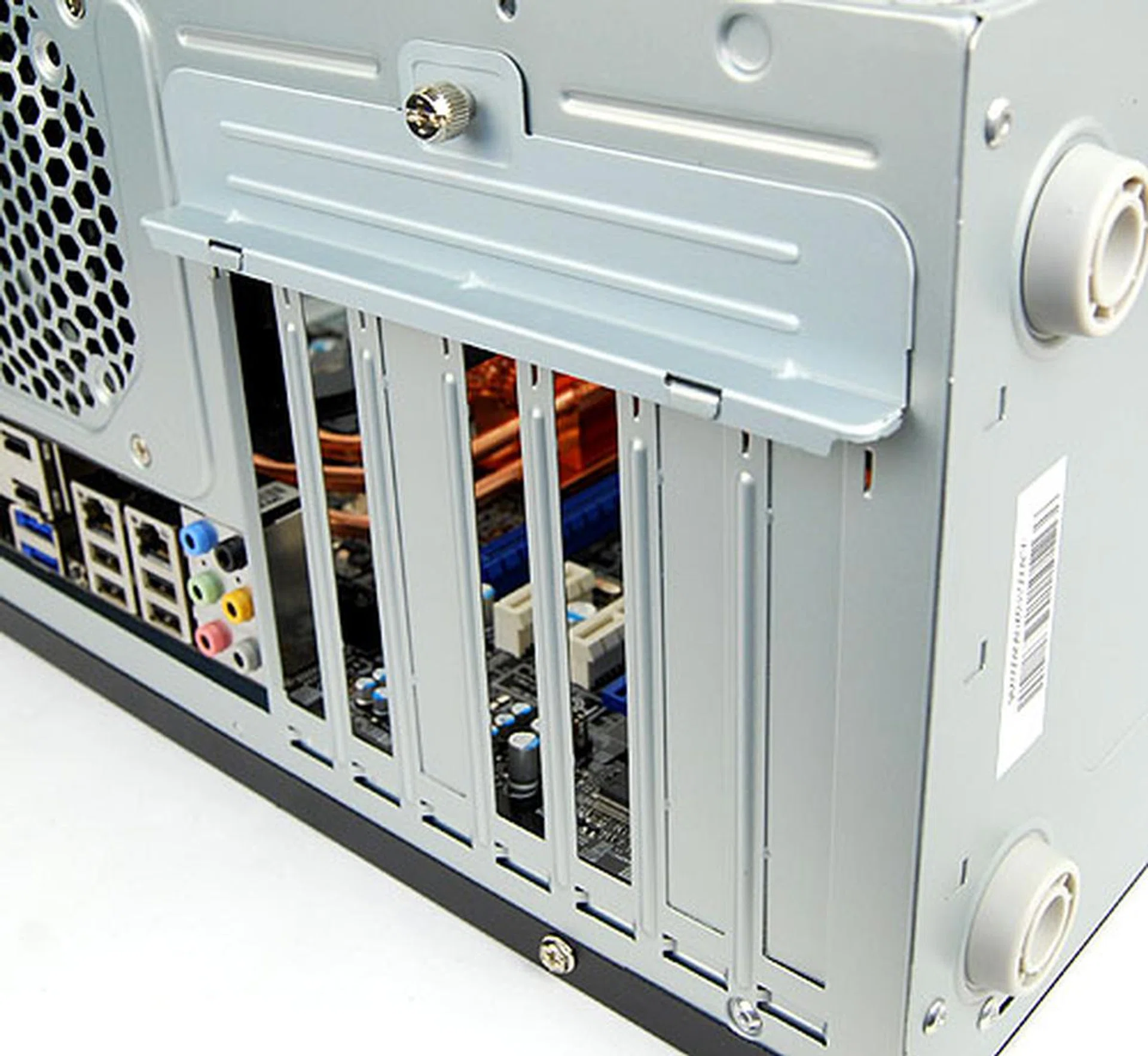 The seven expansion bays are of the tool-free variety, but the implementation isn't the most elegant, requiring users to first undo a thumbscrew and then remove a mounting bracket that secures all devices in place.