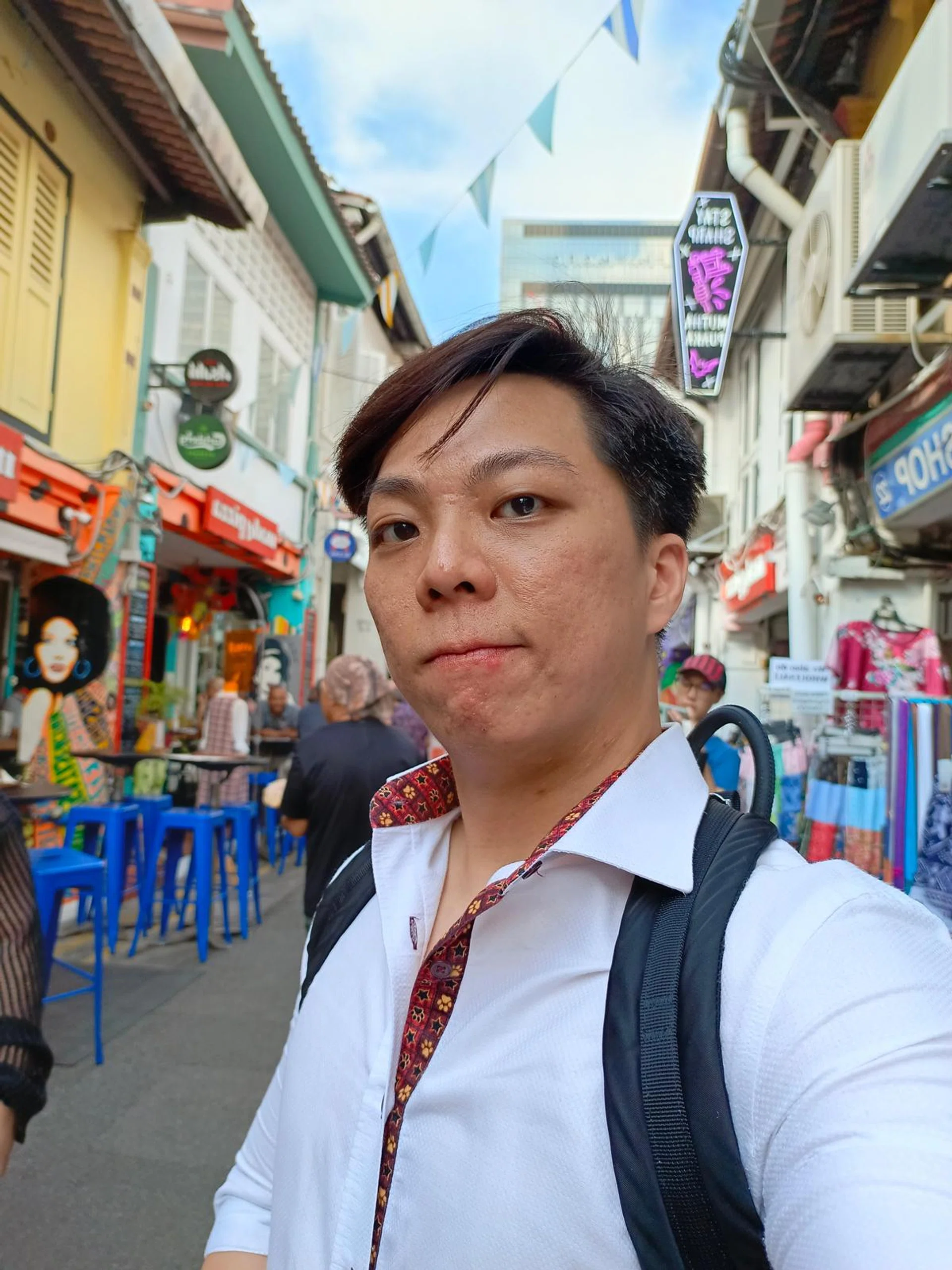 Main camera shot using Cover Screen as the viewfinder. Without filters, the camera was able to accurately capture a very ripe pimple along the lip.