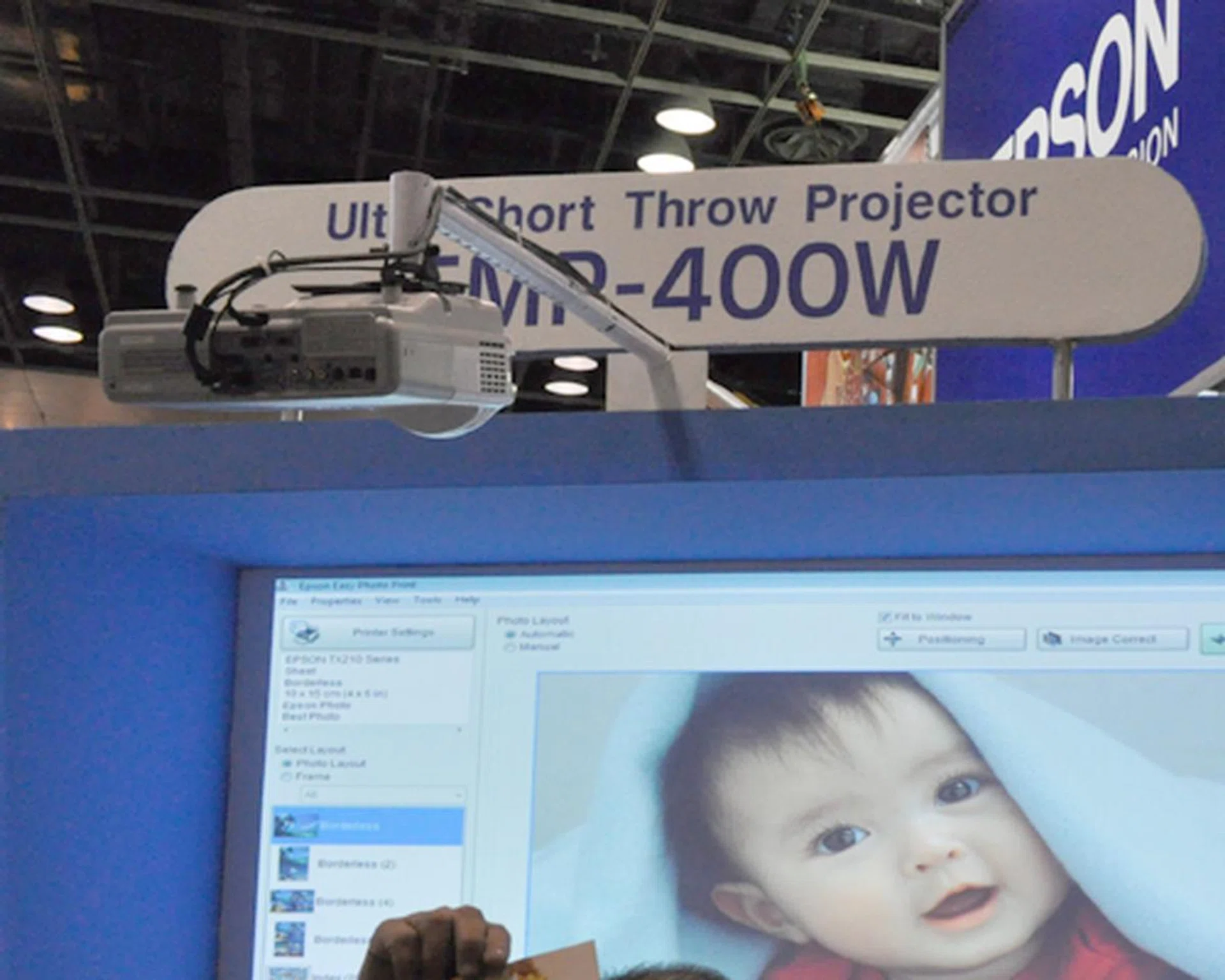 Place close attention to the hanging projector. That's the ultra-short throw projector, the Epson EMP-400W. With a rated lumens of 1800 and able to display resolutions up to 1280 x 800, this Epson projector comes with a free additional lamp and a screen, for the price of $1988.