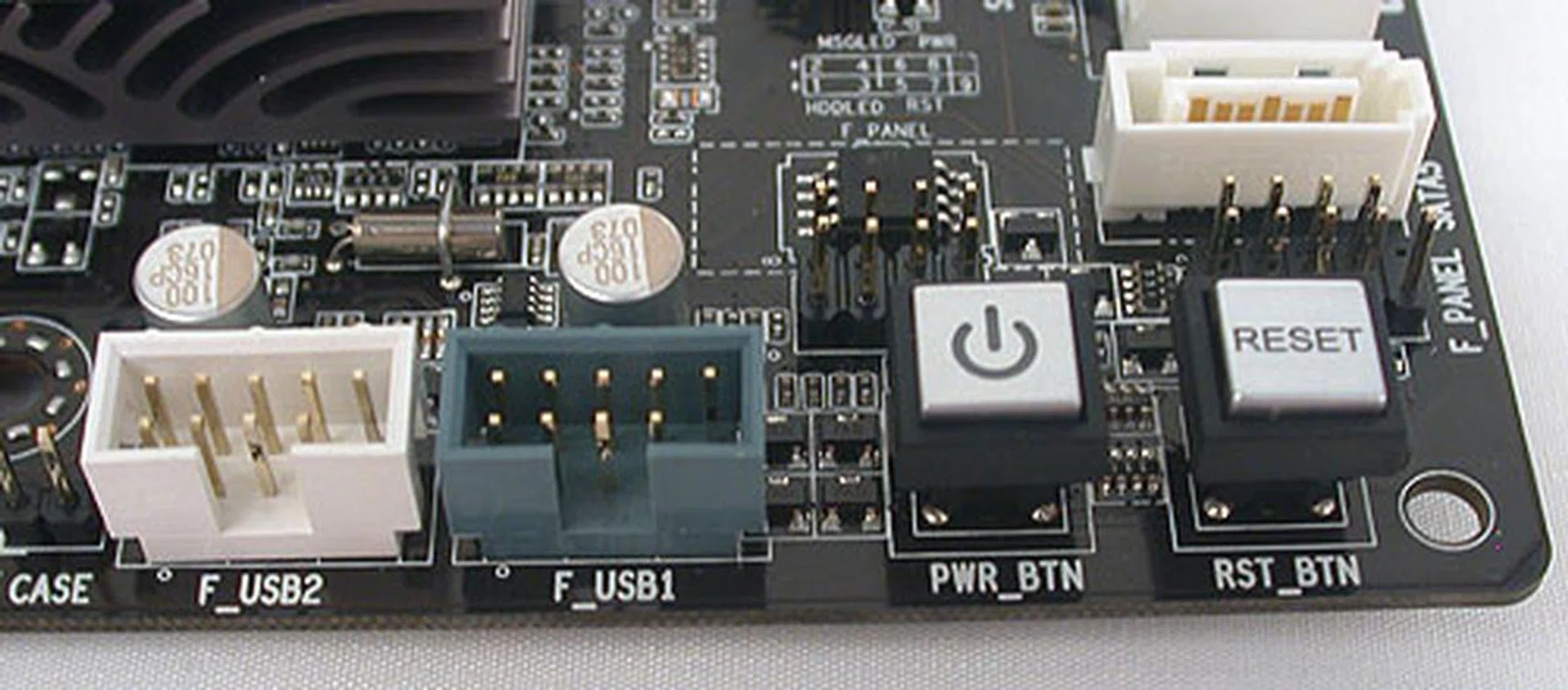 Power and reset buttons along with USB headers.