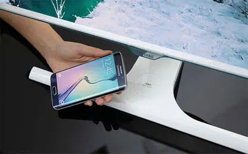 The Samsung SE370 monitors come with a wireless Qi charging pad built into their stands. (Image Source: Samsung Tomorrow)