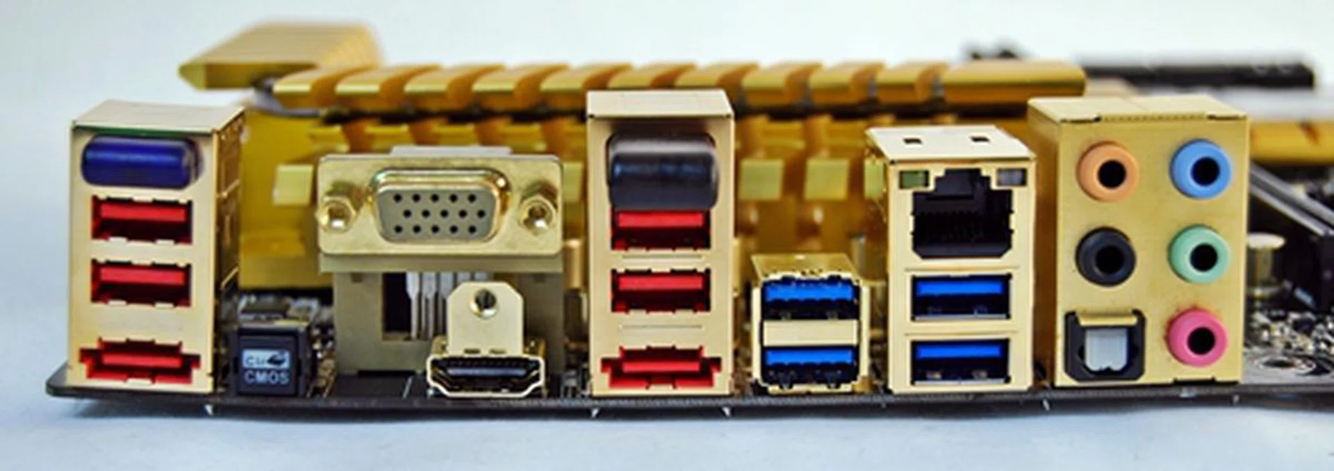 Like the MSI Z77A-GD65 board, its rear I/O panel features a D-Sub VGA port, but it is missing a DVI port. In terms of wireless connectivity, it has a Bluetooth dongle (on the extreme right, above the red USB 2.0 ports) and a Wi-Fi dongle located after the D-Sub port, above two red SUB 2.0 ports and an eSATA 6Gbps port. We did notice a little PCB warping on the left edge of the board and we hope this is confined to just our board.