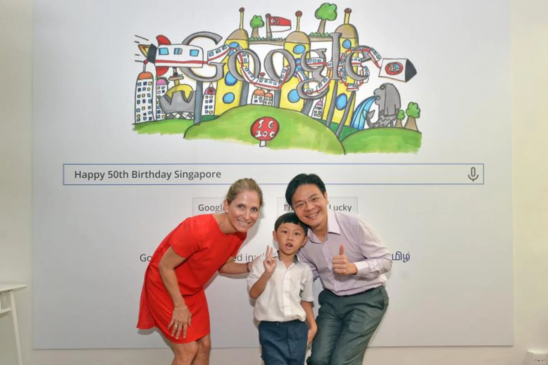 Mr. Lawrence Wong, Minister for Culture, Community and Youth with Google Singapore Country Director Joanna Flint, and Singapore Doodle 4 Google 2015 winner, 8-year old Moh Journ Haydn in front of his doodle. This doodle will be featured on Google during Singapore's National Day. Picture: Google
