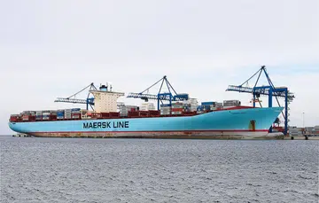 Giant container ships that carry that carry goods around the world are mostly powered by diesel engines. (Image source: Truck Trend)
