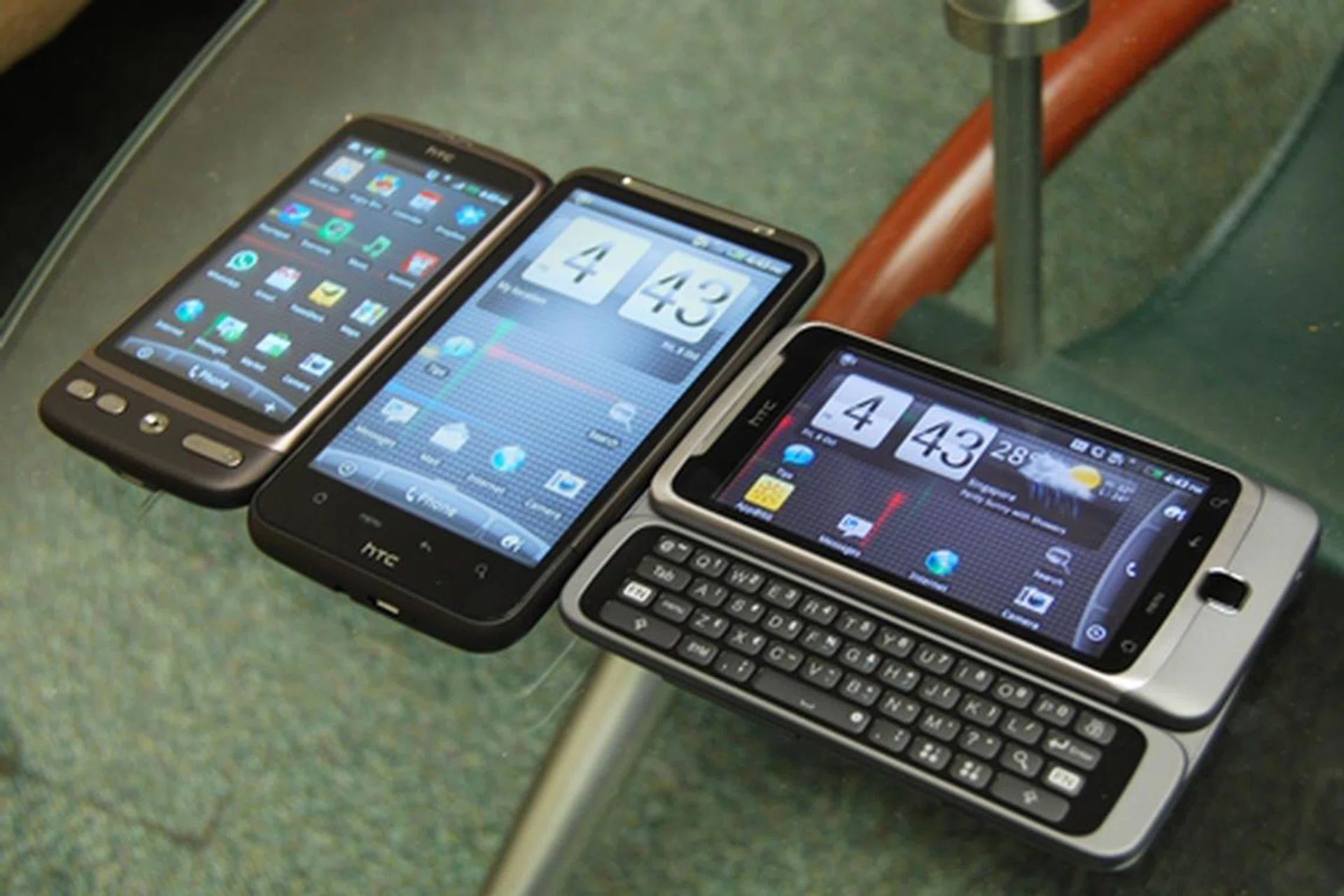 The three Desires, with the HTC Desire HD in the centre, while its left is flanked by the original Desire and on the right, the Desire Z.