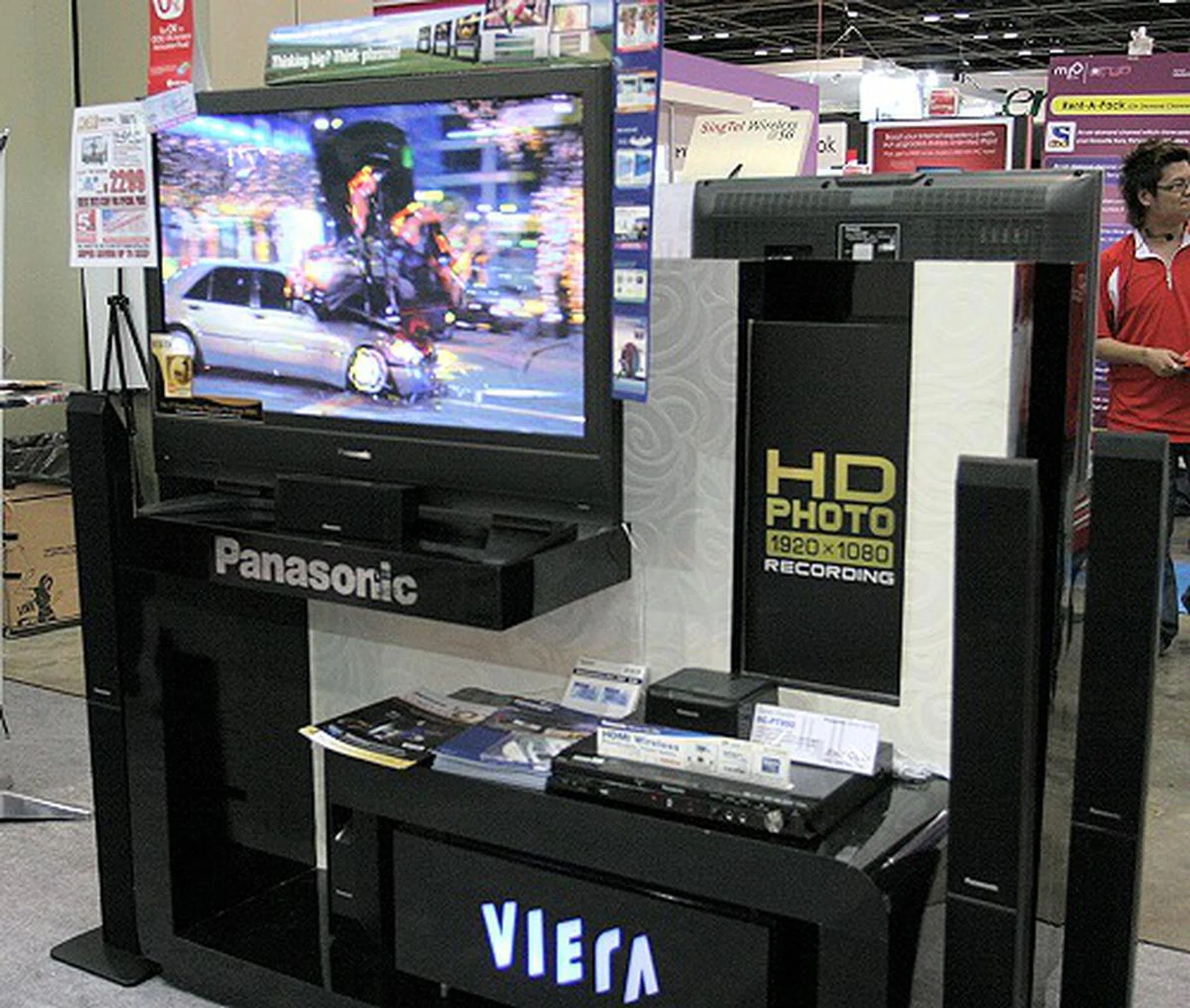  Panasonic's booth was abuzz with TVs, DVD recorders/players, HT systems, DV Camcorders and Digicams. Showcased here is their Viera Link at work and highlights the ease of which to set up a HD ecosystem. However note that the $2299 42-inch Plasma TV here isn't using a Full HD panel, but it can accept and rescale Full HD signals to suit its screen.  