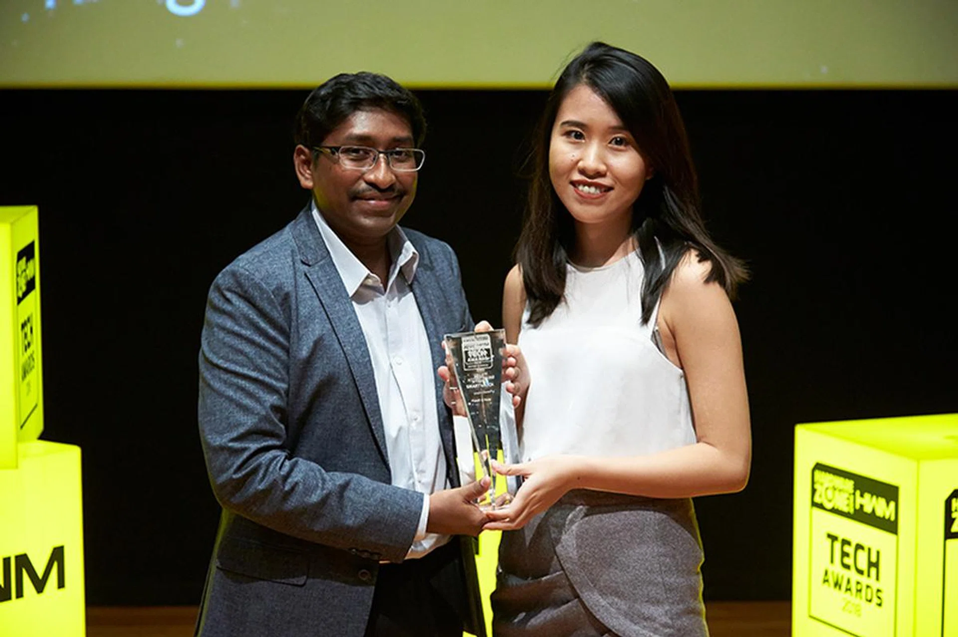 The Fossil Q Nate wins our Editor's Choice for Best Hybrid Smartwatch. Accepting the award here on behalf of Fossil is Ms. Vivian Liu.