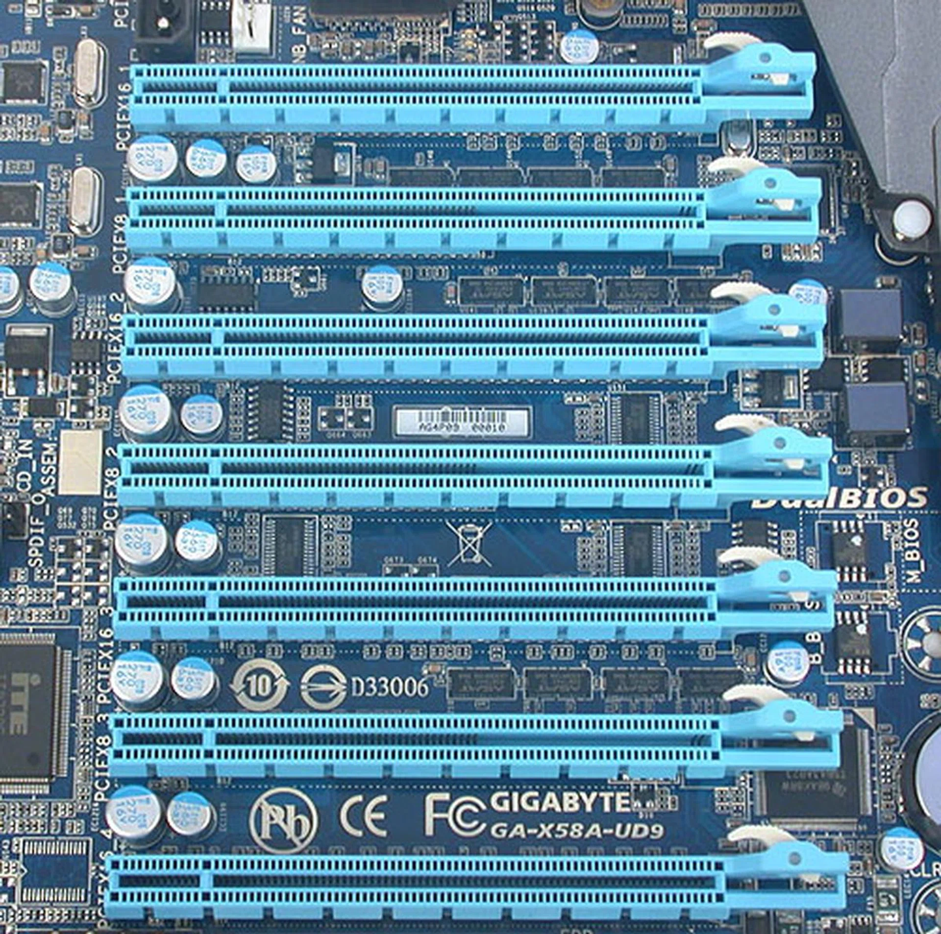 And here are the seven expansion slots that's this board main claim to fame. Thanks to two onboard NForce SLI bridges, this Gigabyte board can do 4-way SLI or CrossFireX. There's even adequate spacing between the slots for dual-slot graphics cards. Four of these slots are running at x16 while the remaining three are at x8. 