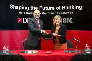 DBS CEO Piyush Gupta and Bridget van Kralingen, Senior Vice President, IBM Global Business Services, announcing the DBS-IBM collaboration. (Image Source: DBS)
