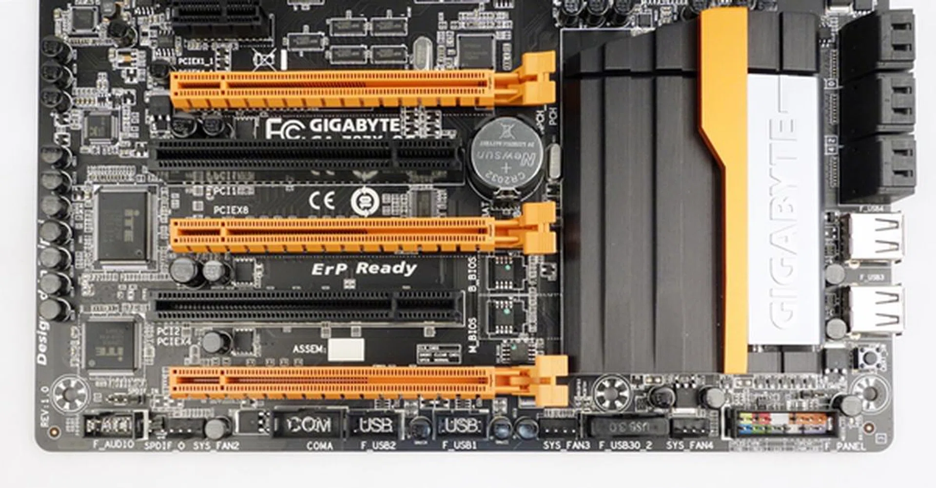 The headers are made up of front panel audio header, COM port header, a pair of USB 2.0 headers, a USB 3.0 one, and a system panel header with some form of color coding to differentiate between the connectors. Amongst the headers, there are three system fan headers.