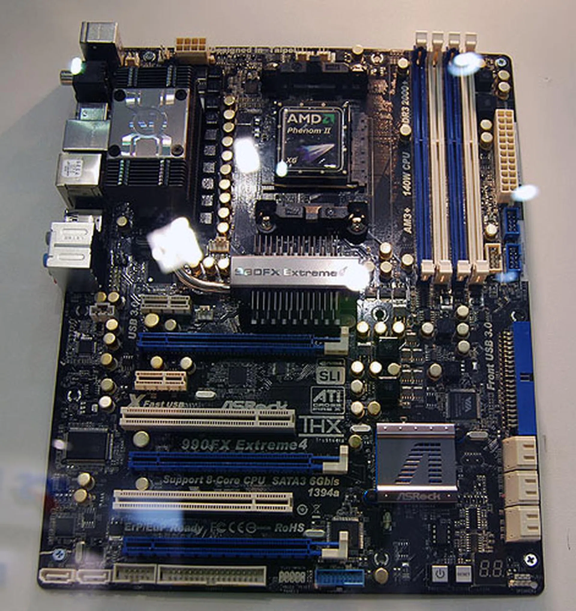 ASRock's 990FX Extreme4 supports up to 2000MHz DDR3 memory and comes with a graphics UEFI BIOS. Three PCIe 2.0 x16 slots support both SLI and CrossFireX (3-way).