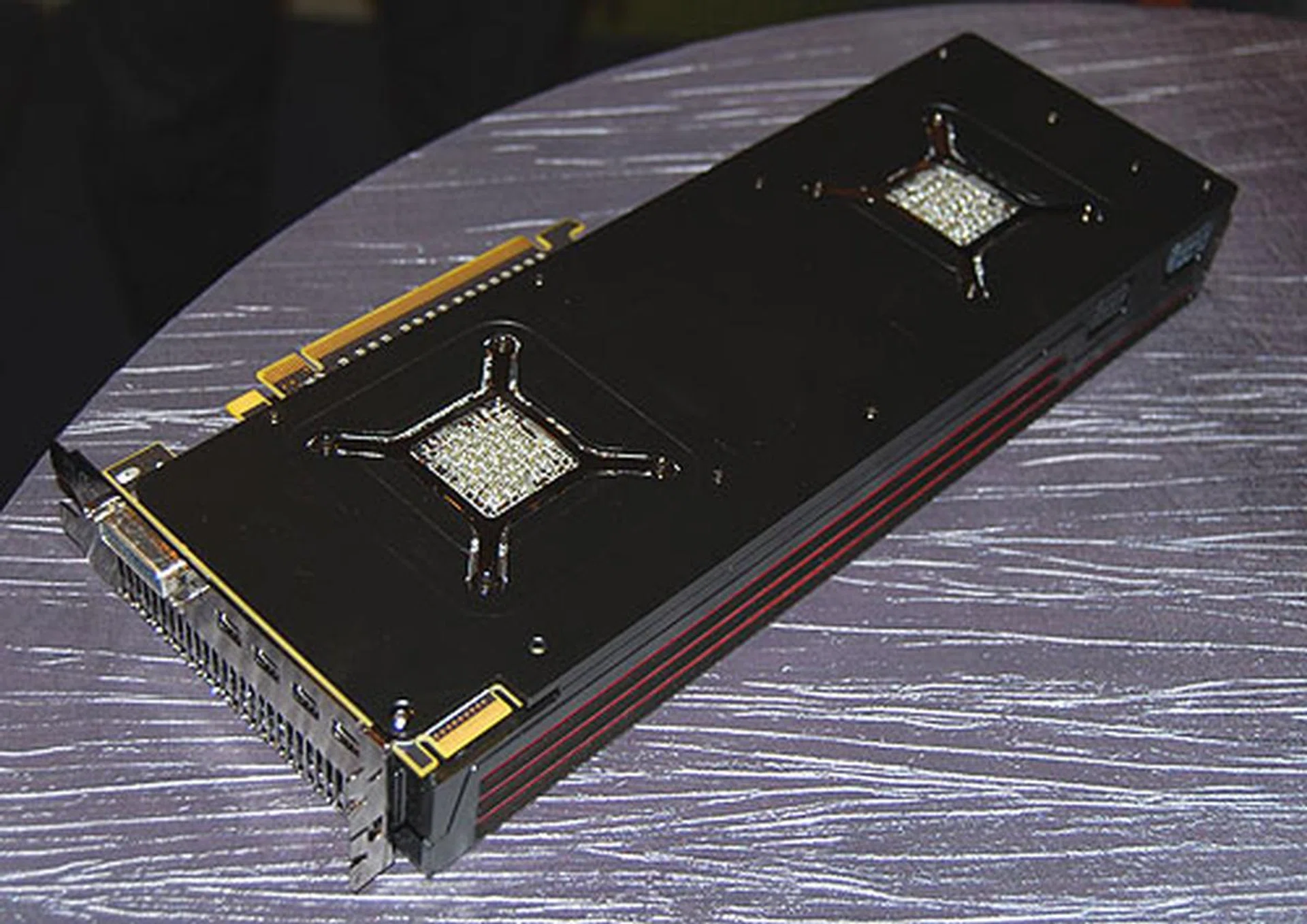 The two GPU cores are exposed at the other side of the PCB. There's also only a single connector for CrossFireX, but with two GPUs on a single card, that's reasonable.