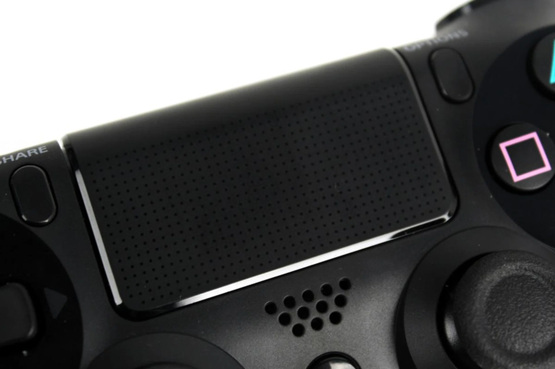The clickable trackpad has a smooth finish, and feels similar to the rear touchpad on Sony's PS Vita.