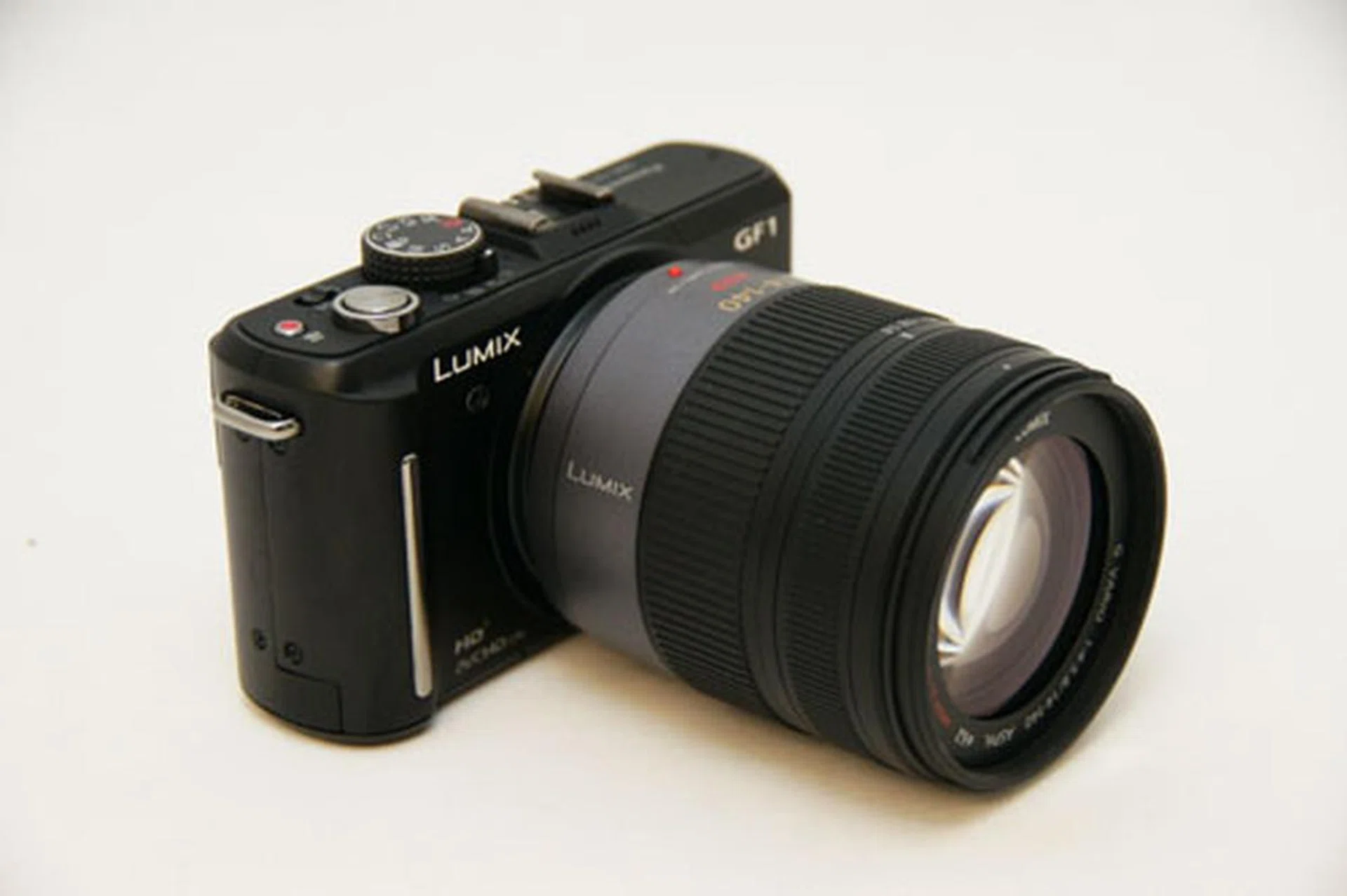 The GF1 with a 14-140mm lens.