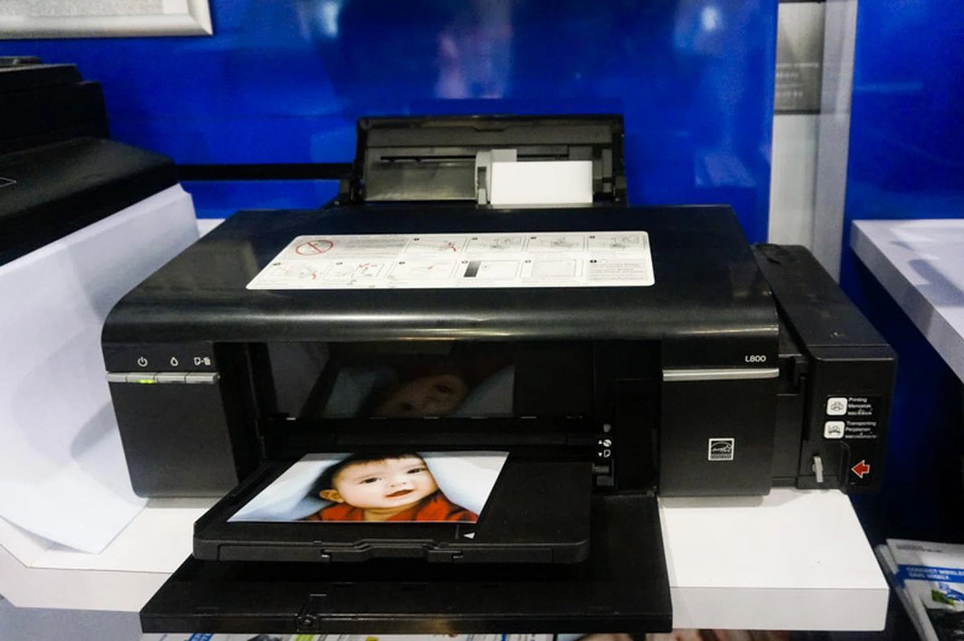 For some reason, they only have the Epson L800 on display, but the Epson L805 looks exactly the same and is a 6-color photo ink tank system printer has a print speed of 37/38 ppm (Mono/Color), Wi-Fi connectivity, and can do borderless 4R photo prints in just 12 seconds. It also prints to CDs, and you can do regular A4 mono prints too. This is going for $379, $70 off the list price of $449 and comes with one year warranty or 3,000 pages (whichever comes first).