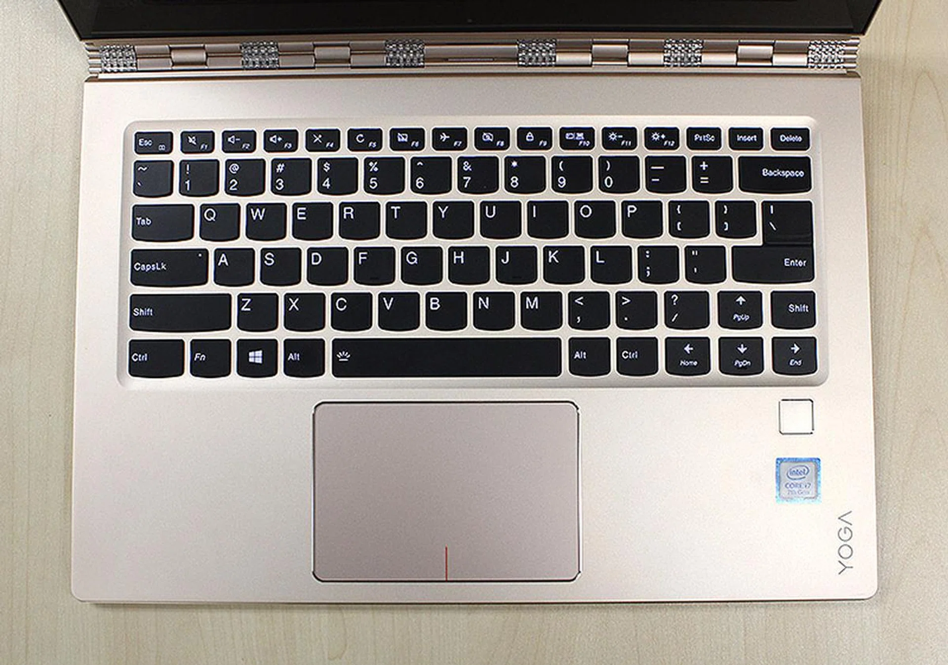 The keyboard is well-sized and tactile, but the position and size of the right "Shift" key is poor and frustrating. Note also the fingerprint reader to the right of the trackpad.