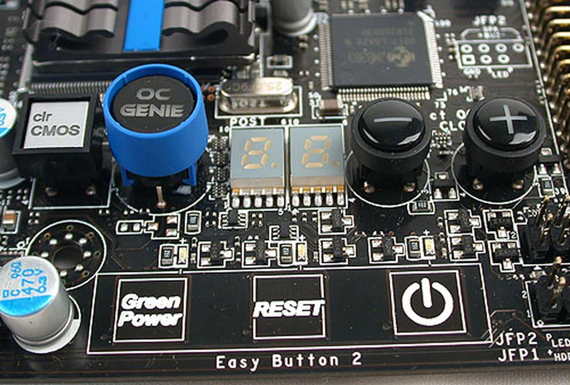 The heart of the onboard controls for the MSI board. A Clear CMOS switch, the OC Genie buttons and 'touch sensitive' capacitive buttons for Green Power, power and reset.