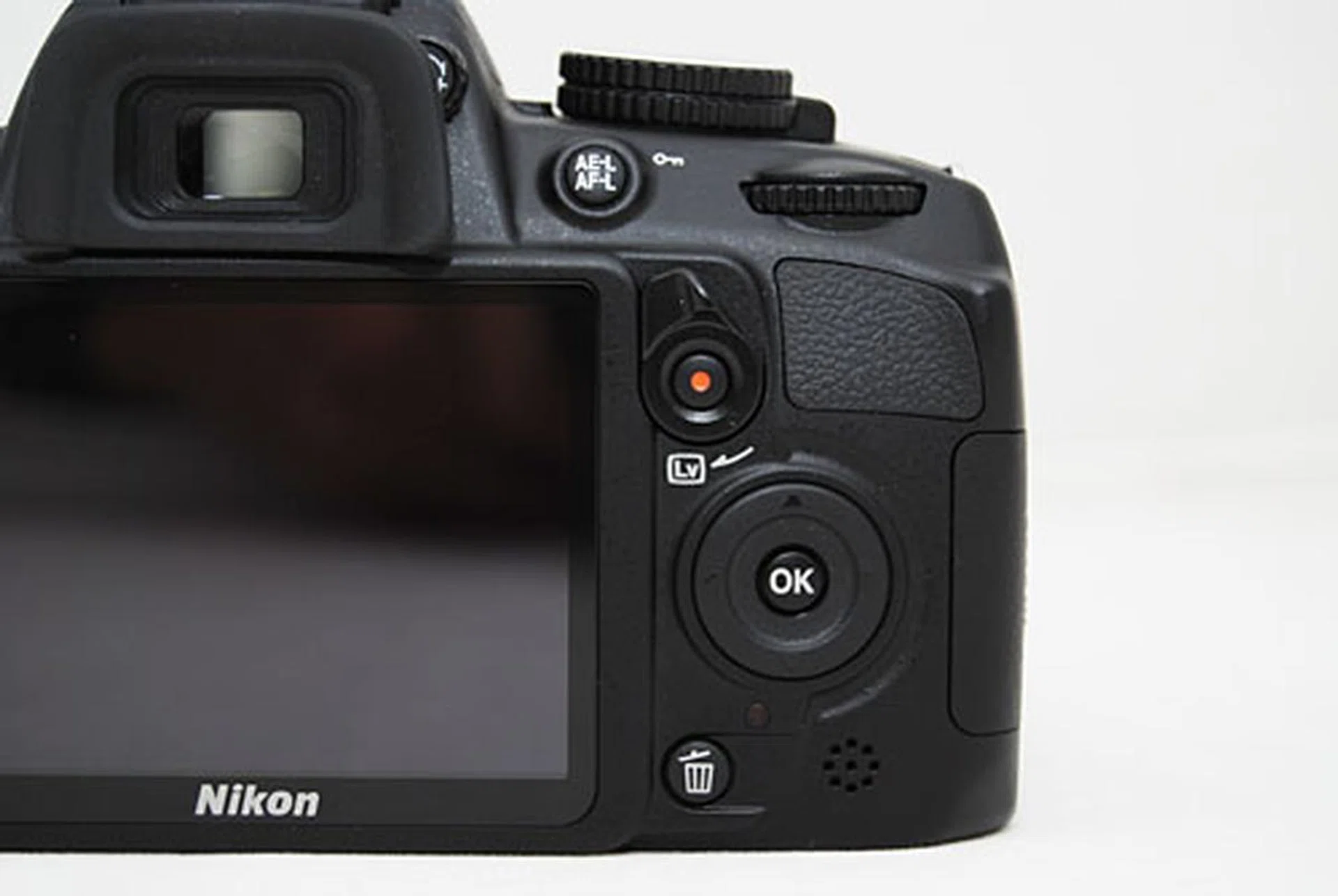 In comparison to the integrated Live View flip and video Record switch found on the D3100 (pictured) and the D7000, which we think is a better implementation.