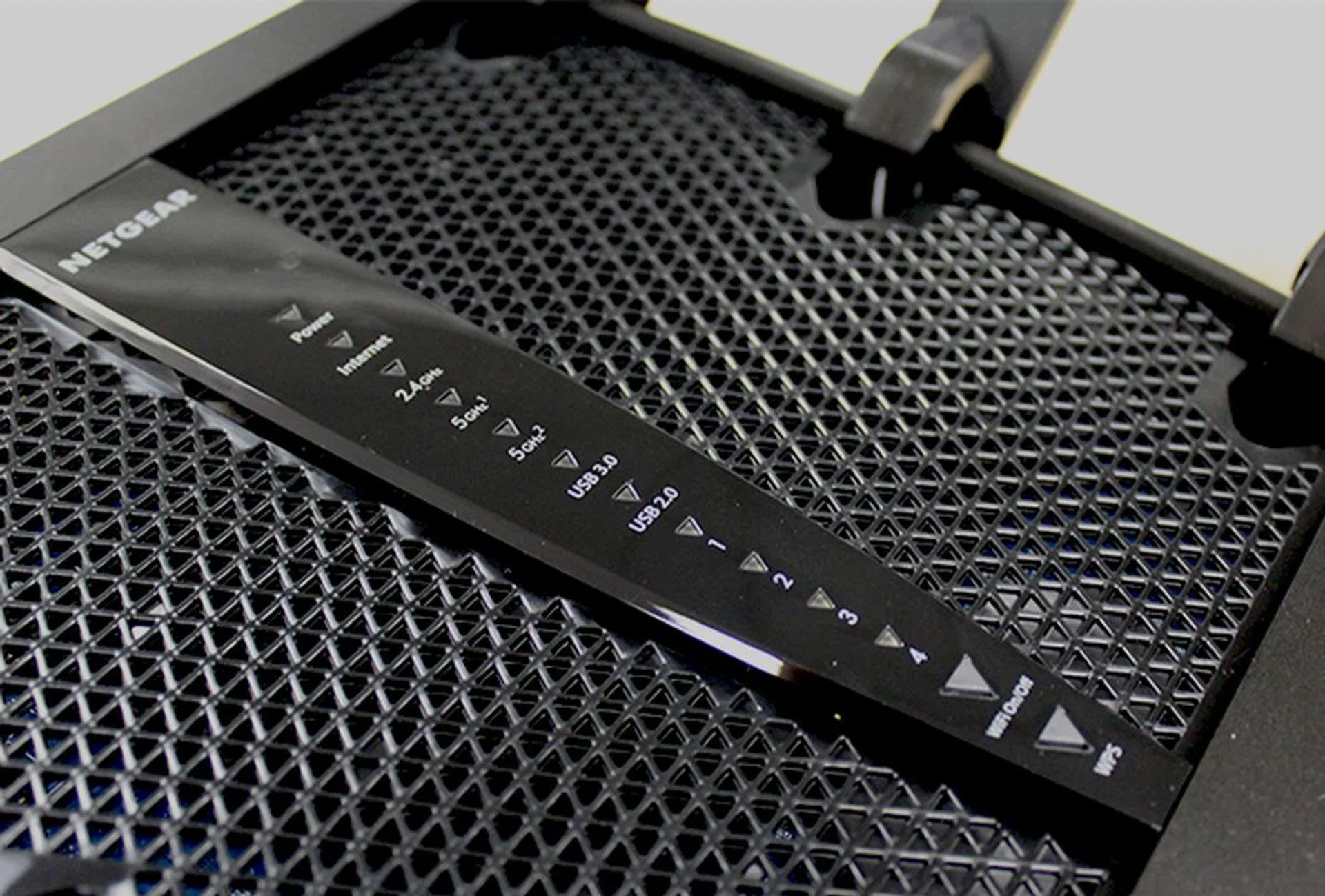 LED indicators on the top panel show the status of the router, while buttons below let users to disable Wi-Fi and for WPS setups.