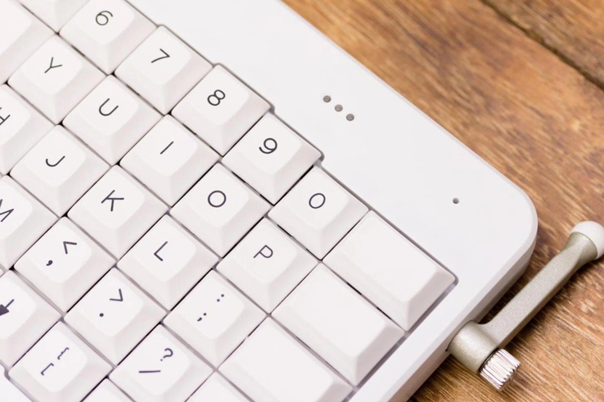 Download the config file, load it into the Teensy app, stick a pin into this hole, and you’ve just reconfigured your ErgoDox EZ.