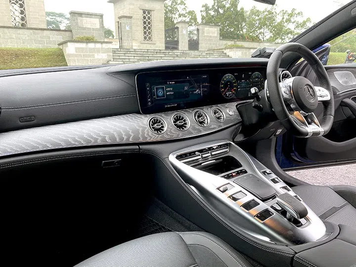 The cabin is sumptuous and modern. Note the two large digital displays forming most of the dashboard.
