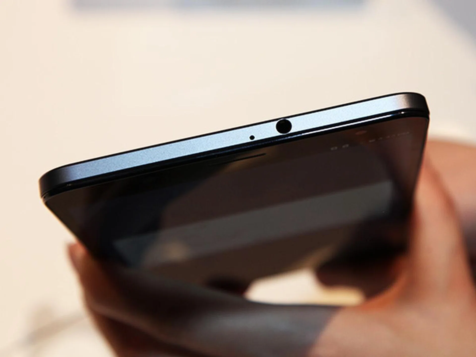 On the top side of the device, you'll find the earphone port.