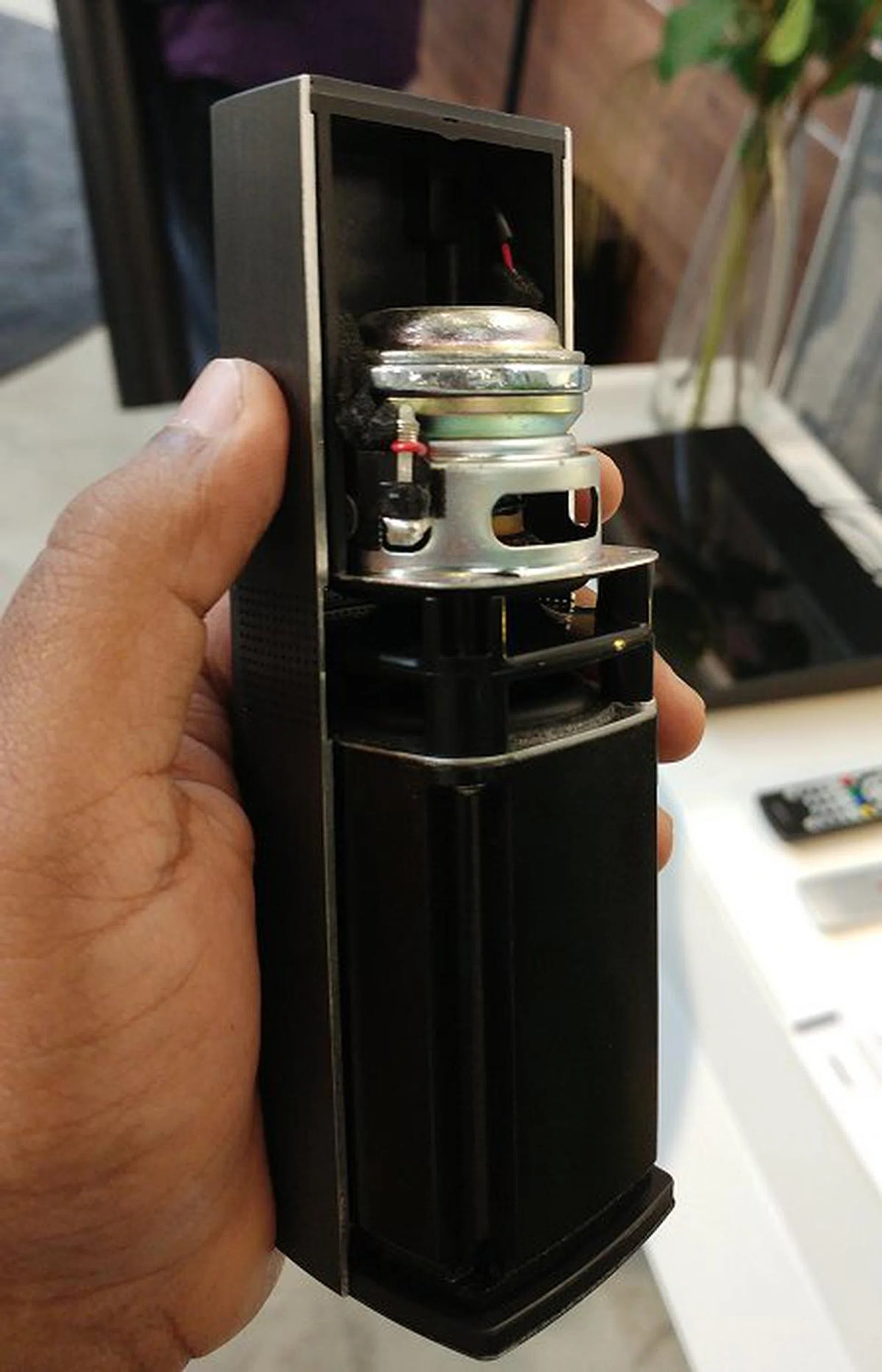 In this partial cutaway model of the OmniJewel satellite, you can see one of the dual opposing set of drivers within the enclosure; the other is barely visible as it's not a full cutaway model.