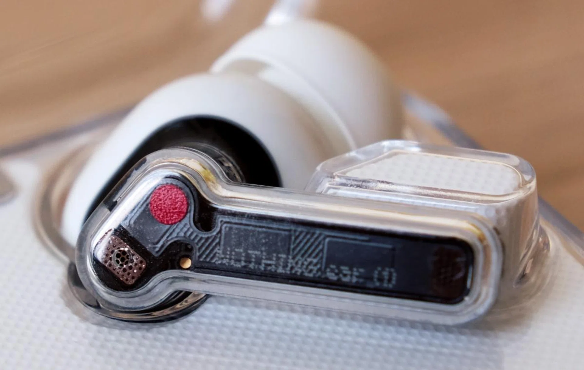 The earbuds' stems are see-through.