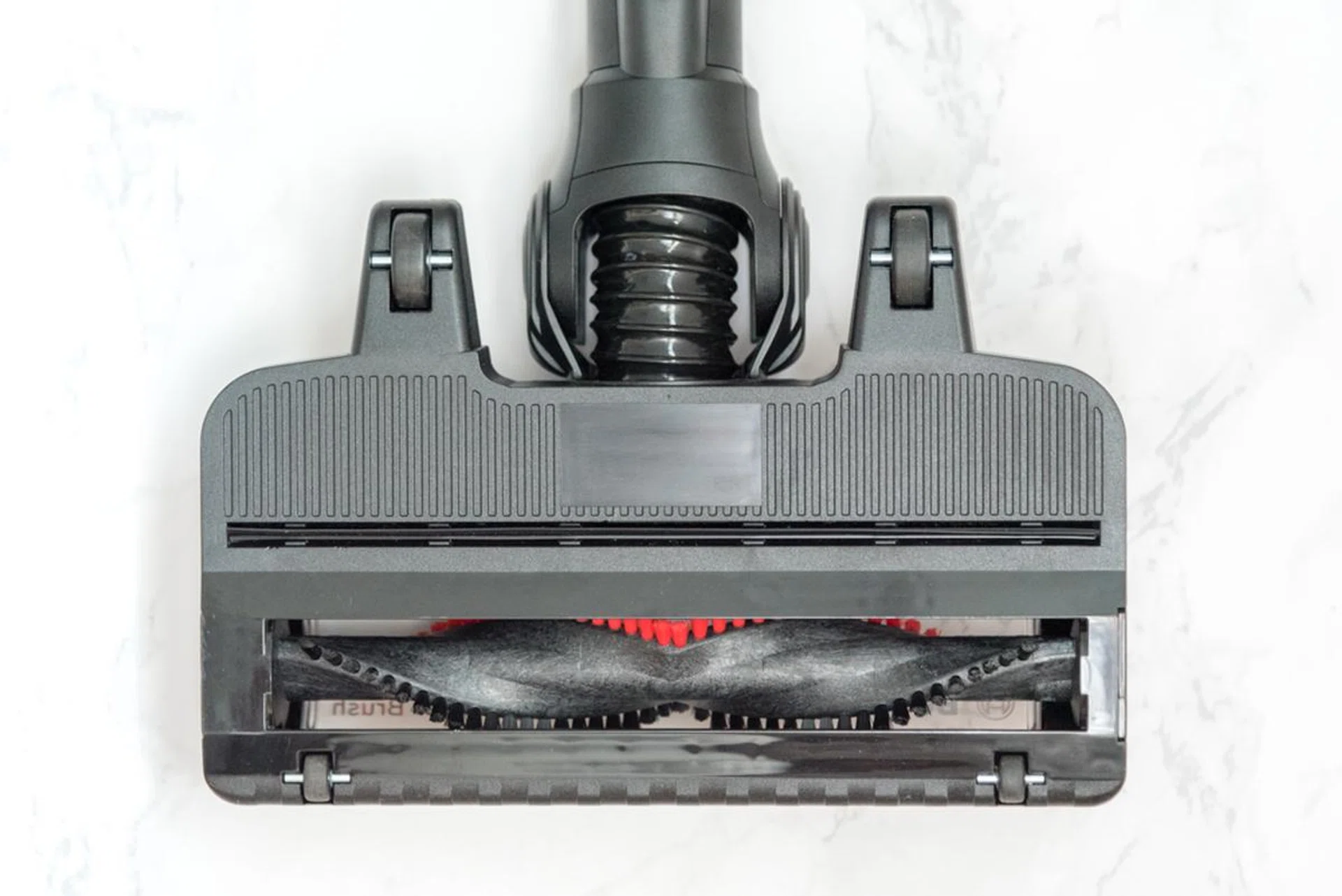 The roller cleaner head glides gracefully across floors, thanks to four wheels on its undercarriage.