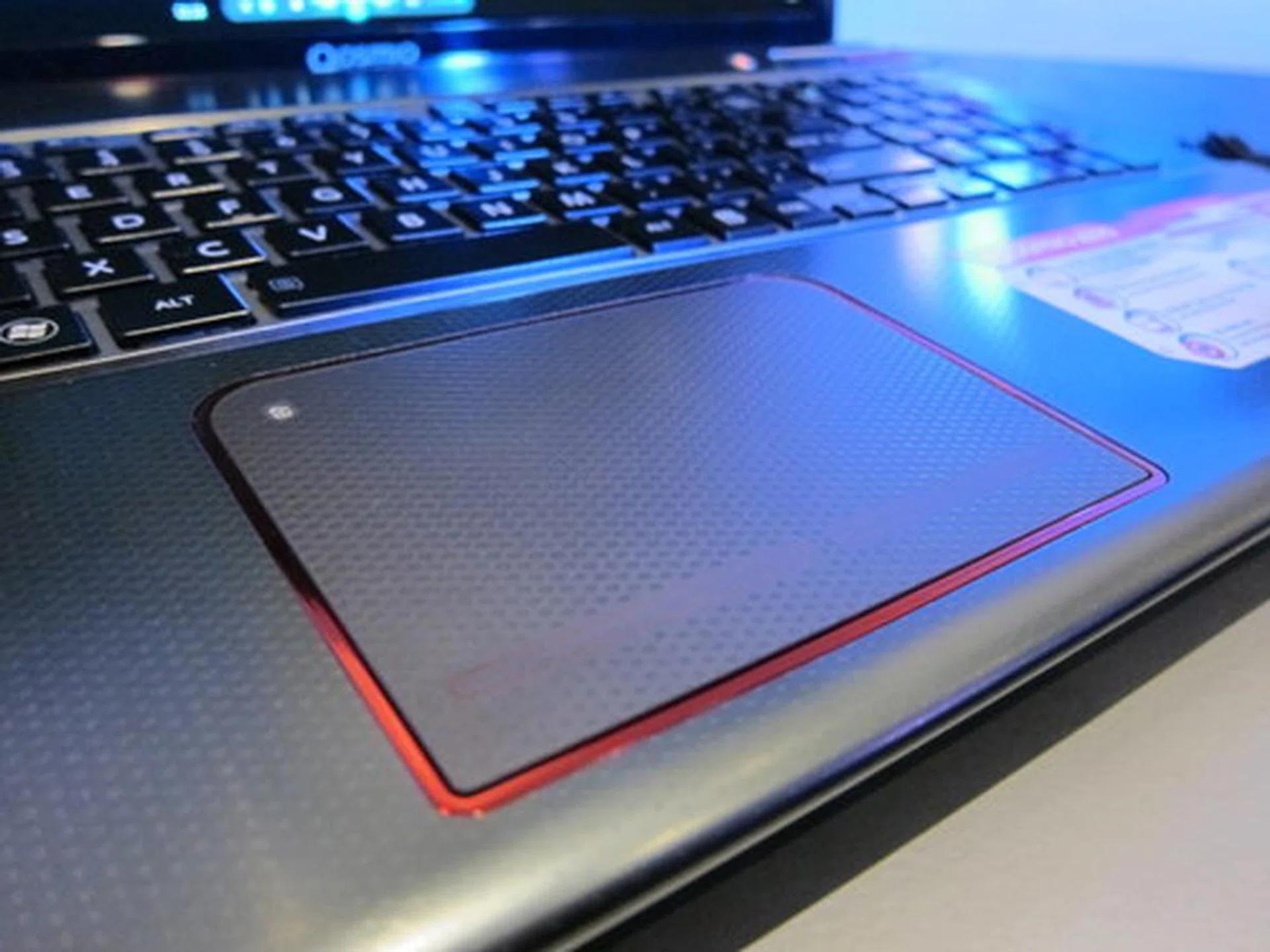 The red border along the gigantic trackpad doesn't light up or does anything fancy, but it does add to the overall aesthetics. The LED light at the top left corner lights up when the trackpad is disabled. 
