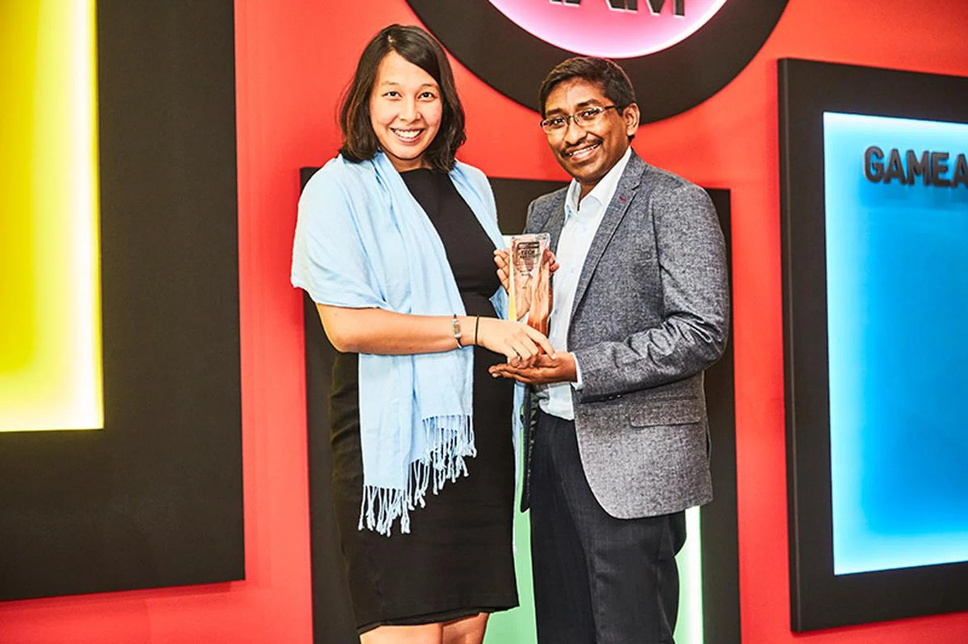 Intel is once again our readers' favorite CPU brand. Hee's Ms. Kim Danker, Intel's PR Manager for SEA, accepting the award.