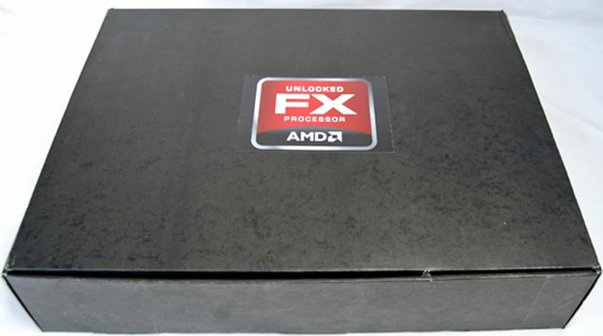 The AMD FX processor press kit is this large black box that contains the AMD FX Processor tin box, ASUS Crosshair V Formula motherboard and a FX Scorpius Platform belt buckle/medallion. The AMD FX-8150 was already mounted on the board and there was no CPU cooler provided.