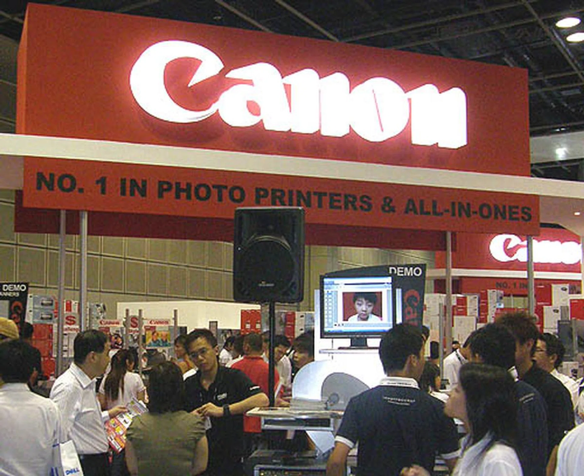  Canon is making its presence felt with a giant booth. The red neon sign doesn't hurt too.  