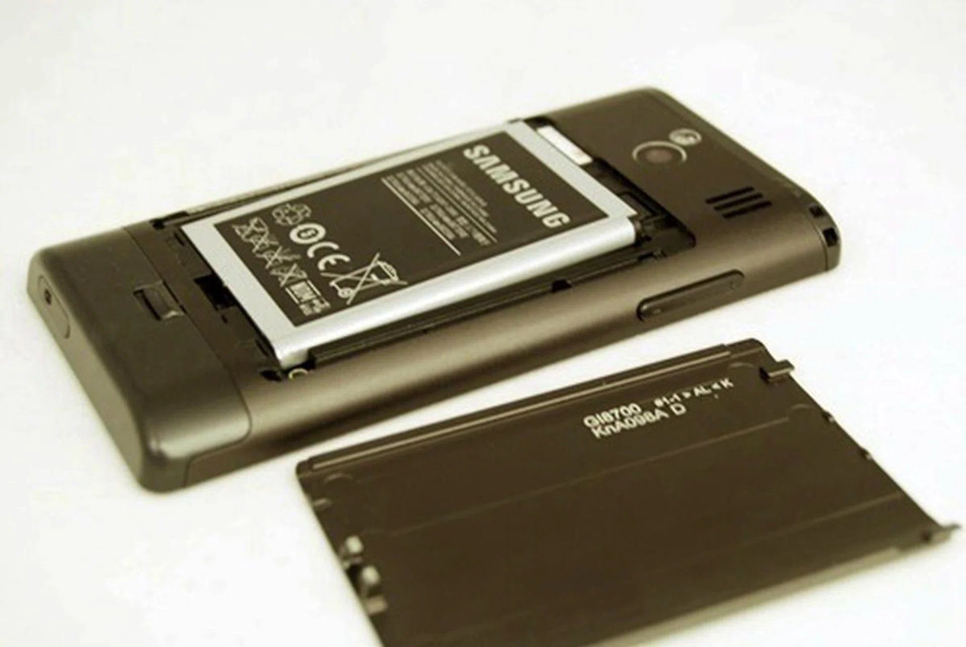 To release the lock that keeps the battery cover in place, simply release the catch just below the cover.