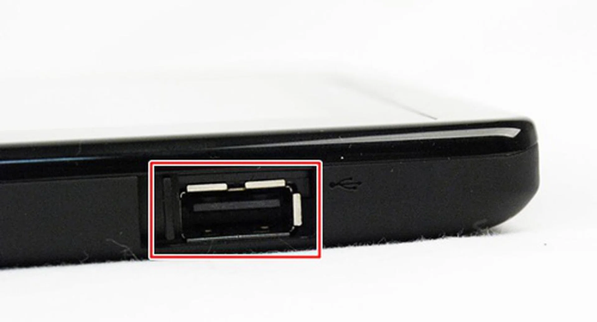 The Lenovo ThinkPad Tablet has one USB 2.0 port located on the bottom right hand corner of the device in landscape mode. The port can be used to connect the device to its keyboard Folio case. Lenovo does a good job here with the sliding cover to protect the USB port whenver it is not in use.