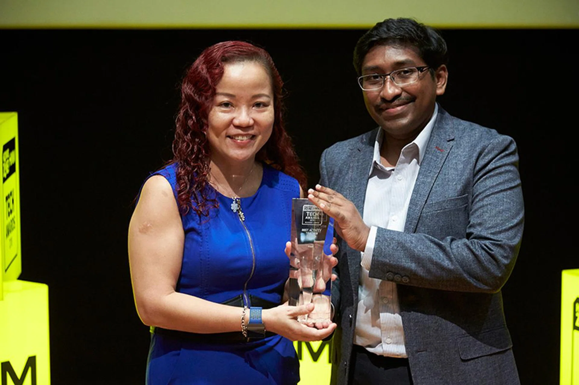 Ms. Mabel Chu from Fitbit is here to receive the Readers' Choice award for Best Activity Tracker Brand.