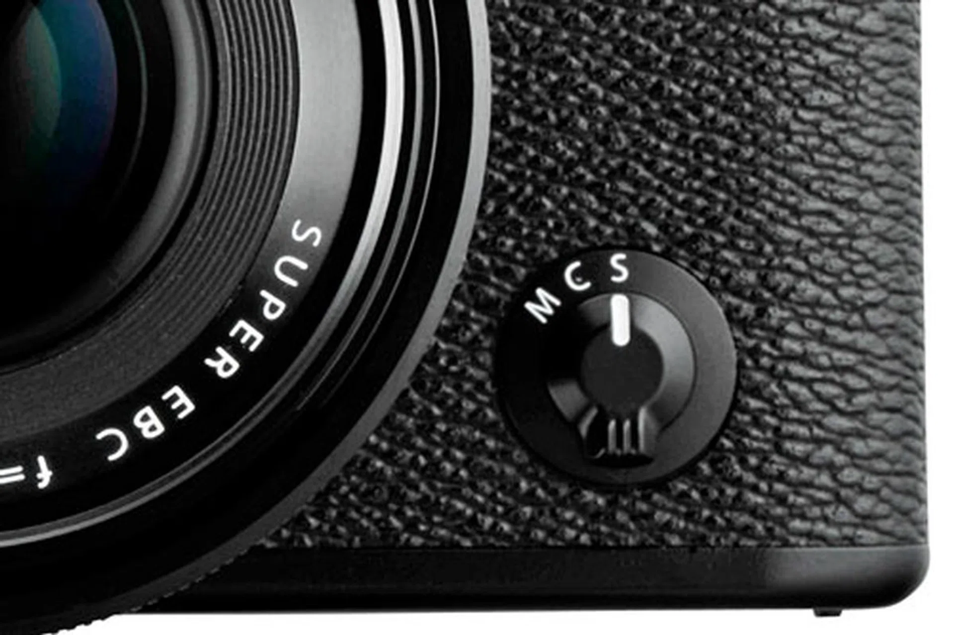 The focus switch on the front of the camera lets you switch between automatic ('S' for Single AF, 'C' for Continuous AF) and manual focus ('M').
