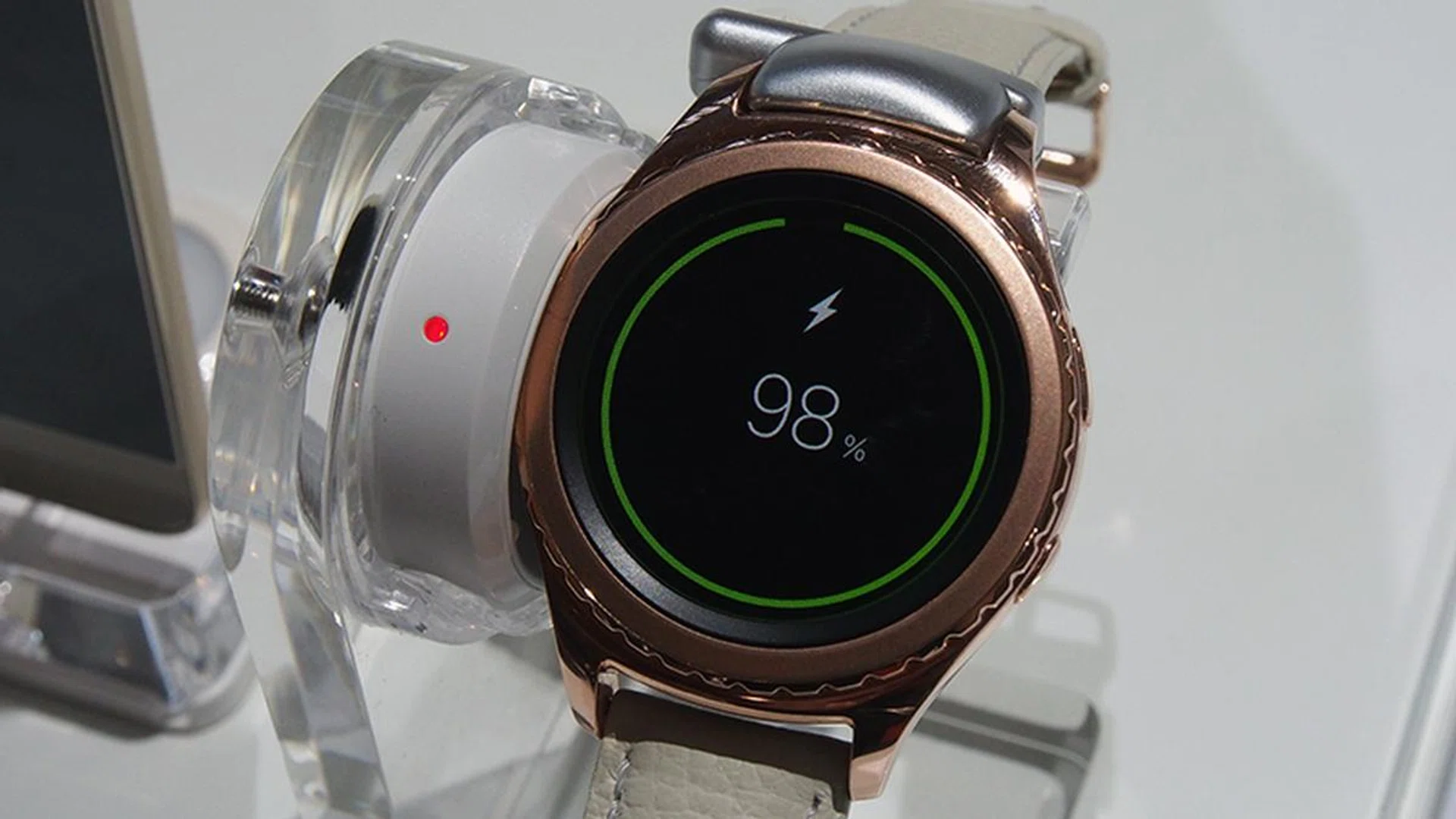 The Gear S2 Classic here is attached to a wireless charging dock.